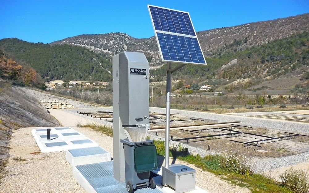 Solar-powered water pumping station in a field